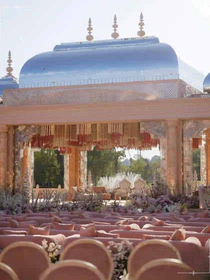 The palatial setup for the Adani wedding, with its silver dome and blush-toned seating. This demonstrates our ability to manage and execute events of significant scale, creating a regal environment that leaves a lasting impression.