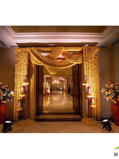 The entrance to the Haldi ceremony was draped in curtains of golden marigolds. This created a warm and auspicious welcome for guests, setting the tone for the joyful celebration inside.