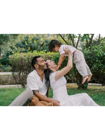 A family playing together on the grass. These sessions are about interaction and connection, creating a space where you can relax and just enjoy being with each other.