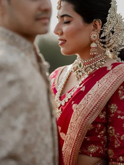 An artistic portrait using shallow depth of field to draw focus to the bride's serene expression. This technique allows us to create fine art wedding photos that are both beautiful and emotive.