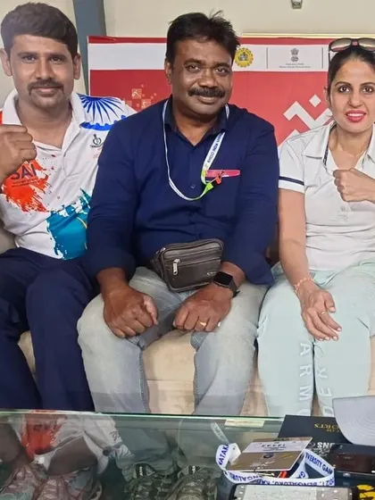 A moment with colleagues during the boxing competition. Being part of the larger sports community is a vital part of my role as a coach.