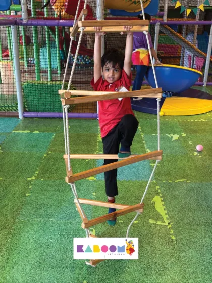 Another determined climber on our rope ladder. We provide a variety of physical challenges to keep kids of all skill levels engaged.
