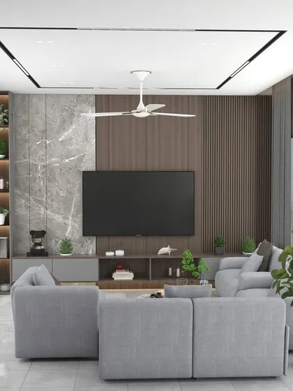 A contemporary living room with a custom media wall combining marble and wood panels, integrated shelving, and recessed ceiling lights for a clean, modern look.