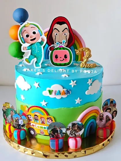 A cake for a toddler who loves both Cocomelon and Money Heist. This quirky combination was so much fun to create, especially with the added personal touch of family photos as his "gift."