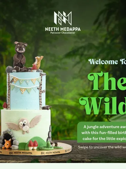 Welcome to the wild. This two-tiered jungle adventure cake features a Gruffalo-inspired theme with a curious fox and a wise owl.