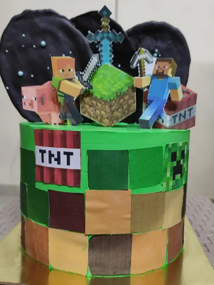I love bringing your favorite worlds to life, like with this custom Minecraft theme cake. The design features edible block textures and non-edible character toppers to create a centerpiece perfect for any gamer's birthday.