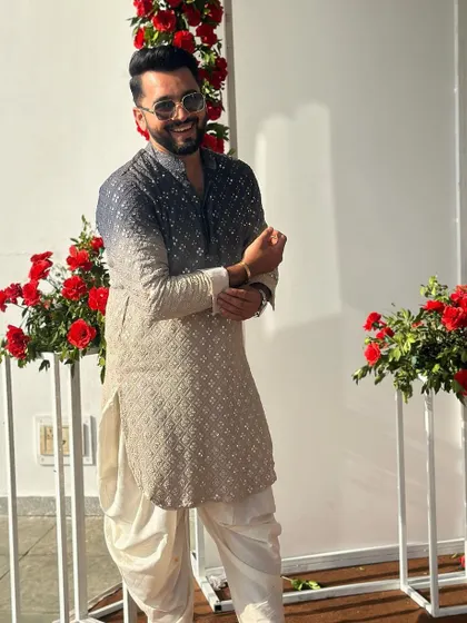 A smiling pose in my designer kurta. My look is always a mix of traditional and modern, which reflects my sangeet choreography style.