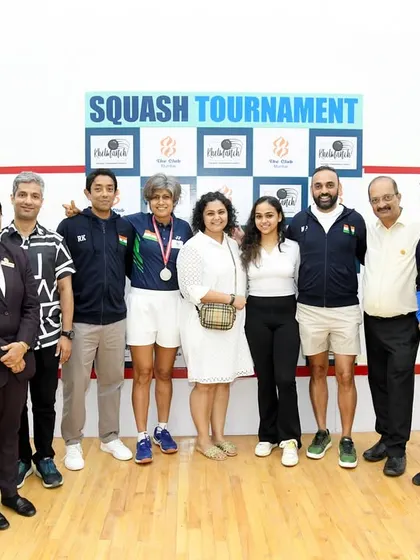 The team behind the scenes and the champions on the court. A group photo celebrating a successful squash tournament at The Club, Mumbai.