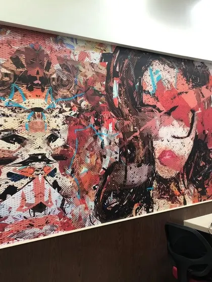 A bold, abstract graffiti-style mural installed in an office space. This edgy and artistic design can add a lot of character and creative energy to a modern workplace.