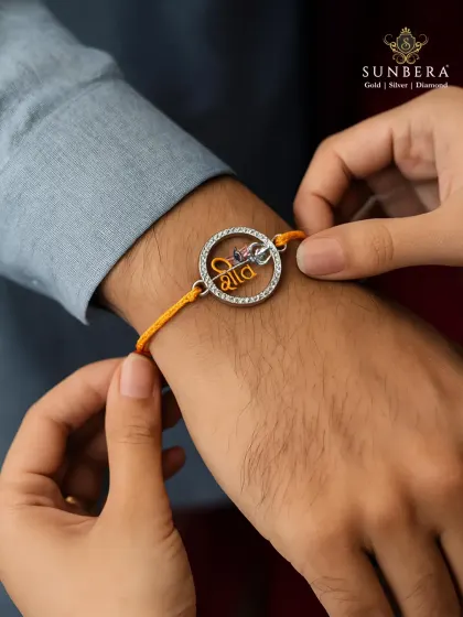 A rakhi is more than a thread, it is a bond that shines. This lifestyle shot captures the emotion of Raksha Bandhan, featuring a custom silver rakhi designed to be as special as the relationship it celebrates.