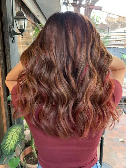 The back view of this stunning chestnut and red look. The waves show off the color perfectly. (No filter)