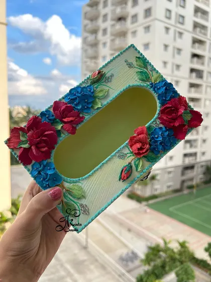 The top-down view of the tissue box, showcasing the beautiful floral arrangement around the opening.