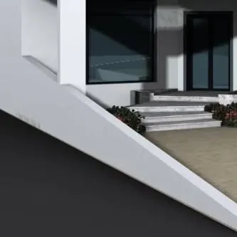 This image details the angular architectural lines of a modern residence and the adjoining steps. The design incorporates small flower beds to soften the hard edges of the concrete and add a touch of color.