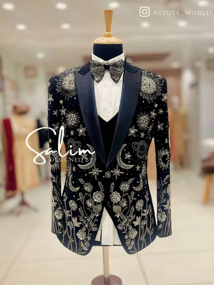 This is one of my most detailed creations, a celestial-themed tuxedo jacket. It features hand-embroidered planets, stars, and moons on rich black velvet, designed for a truly astronomical impact at any black-tie event.