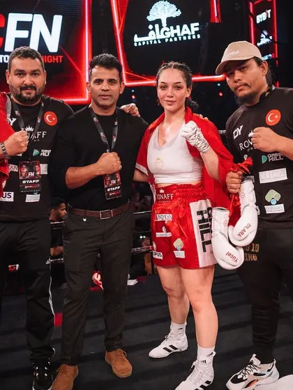 A snapshot from Crypto Fight Night in Dubai, showing our team with one of the international fighters.