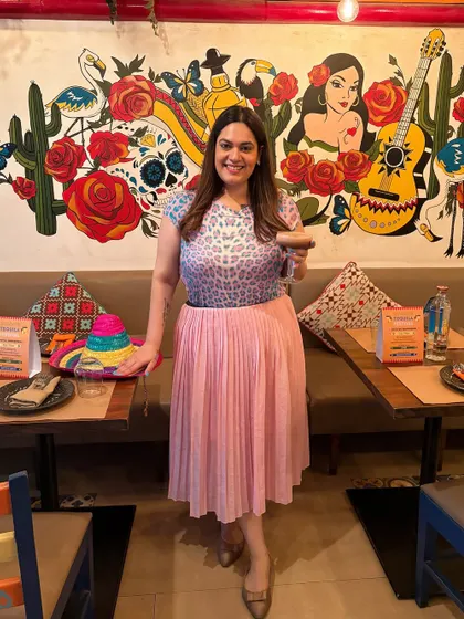Sundays are for margaritas and tacos. Here I am at Miss Margarita by Arriba, soaking in the vibrant atmosphere. I always include myself in the setting to create relatable lifestyle content that shows a real person enjoying the experience.