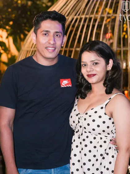 A couple posing in the outdoor area of TYD.