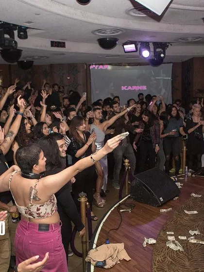 The audience is captivated by a drag performance. These moments of live entertainment make Bollywood Disco more than just a DJ night; it's a complete show.