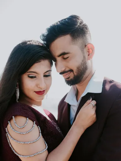 An intimate close-up of a couple during their beach pre-wedding shoot.