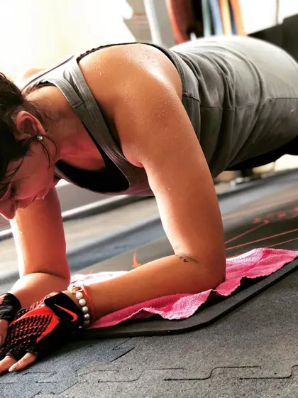 The plank is a powerhouse for core strength. This close-up shot captures the focus and determination it takes to hold proper form and engage the right muscles.