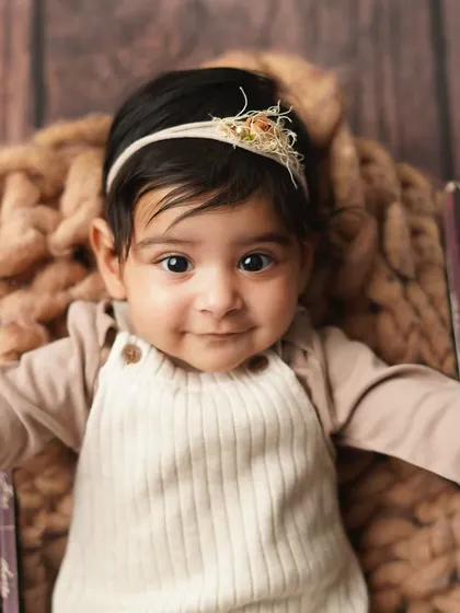 A sweet, direct-to-camera smile that will melt your heart. This portrait perfectly captures her happy and engaging personality.