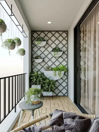 A minimalist approach to a green balcony. This design uses a simple grey lattice for wall-mounted planters and matching hanging pots, creating a serene and uncluttered look with clean lines.