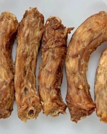 Another look at our popular chicken neck chews. We ensure each one is baked perfectly to be crunchy yet safe for dogs to enjoy.