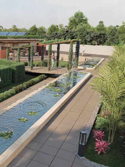 This rendering of the wellness center focuses on the serene water features, including a long channel with lily pads and a vine-covered pergola. The visualization aims to convey the tranquility and restorative purpose of the space.