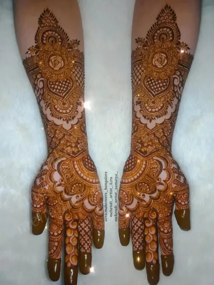 An elegant and symmetrical bridal design with a central rose motif, perfect for a romantic and classic bride.