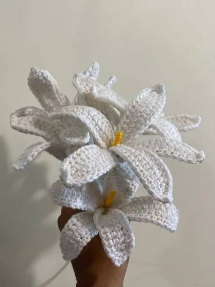 A full bouquet of elegant white crochet lilies. Each petal is carefully shaped to create a realistic and beautiful flower that will last forever.