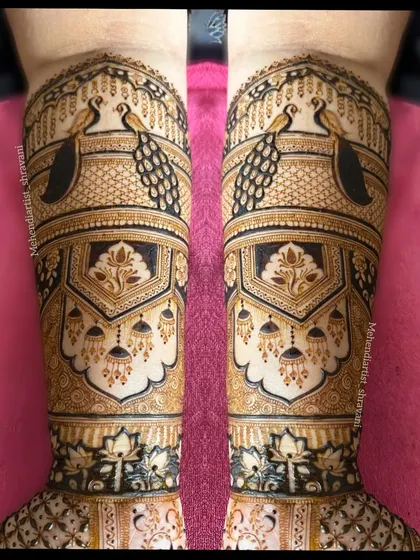 I love creating bold and symmetrical patterns. Here, majestic peacocks are framed by intricate architectural jharokha designs, using dark-fill techniques to make the artwork pop.