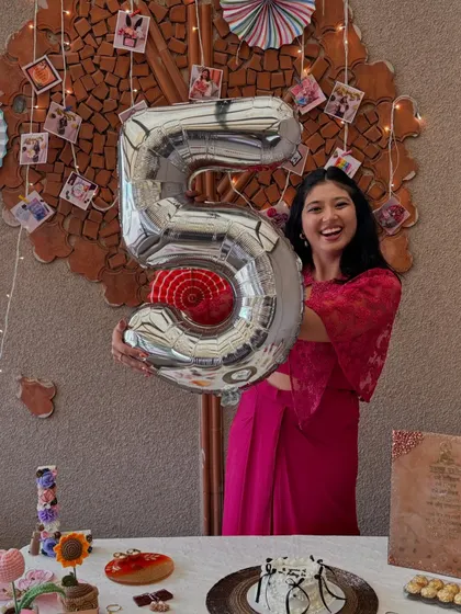 Pure joy celebrating a five-year milestone. Holding this balloon feels like holding five years of dreams, hard work, and countless happy moments.