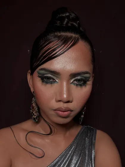 A direct, powerful shot showcasing the intricate details of the eye makeup and the overall mood of the editorial.
