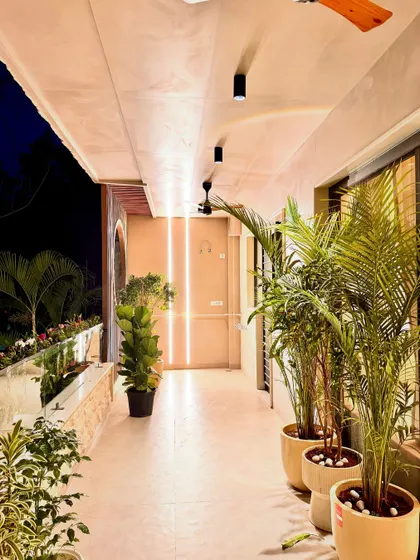 Another perspective of the plant-filled balcony, showing the vertical light strips I integrated into the doorway design. This detail adds a modern touch and helps illuminate the transition from inside to outside.
