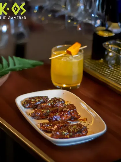 Crispy wings and a chilled drink, the perfect combo. This is how we do game night fuel at K-OS.
