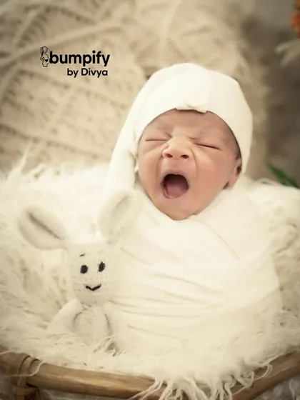 A tiny yawn can be the most precious memory. My newborn sessions are all about capturing these fleeting, natural moments, showing the pure innocence of your baby in a simple, beautiful way.