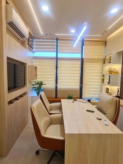 Another view of my office cabin, showing the balance of natural light and artificial lighting. The layout is designed to promote clear communication and a sense of calm, which is essential for my Vastu and astrology consultations.
