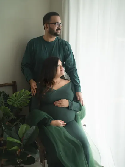 A shared moment looking towards the future. This couple's portrait uses natural light to create a hopeful and serene atmosphere.