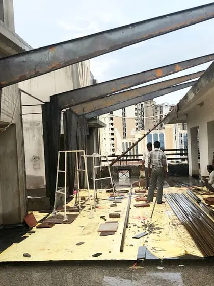 Another angle of the rooftop steel structure in progress. This view highlights how the angled beams create a dynamic form that will ultimately define a sheltered outdoor living space with views of the city.