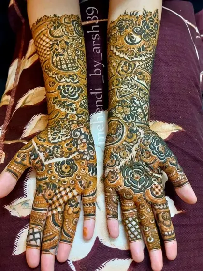 A clear, top-down photo of a completed bridal henna design.