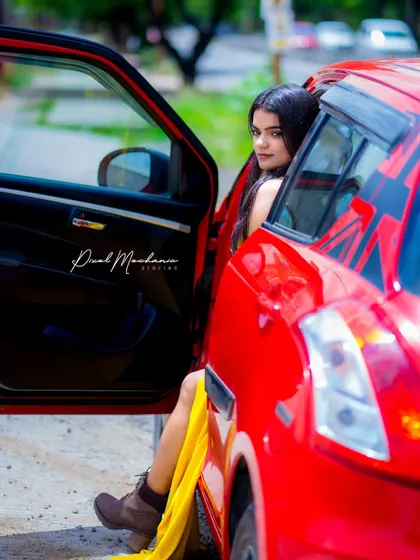 The contrast between the bright yellow dress and the red car makes for an incredibly vibrant and eye-catching automotive portrait. We used the car as a prop to frame the shot and add a story.