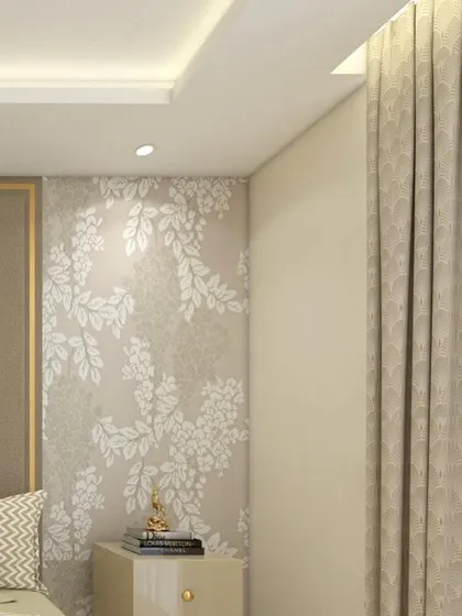A detail shot of a master bedroom, showing a floral wallpapered accent wall next to the bed. A small Buddha statue on the nightstand adds a touch of serenity to the elegant space.