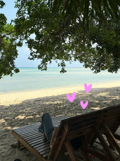 A peaceful moment on a beach chair, with a few simple heart doodles to show the love for this place.