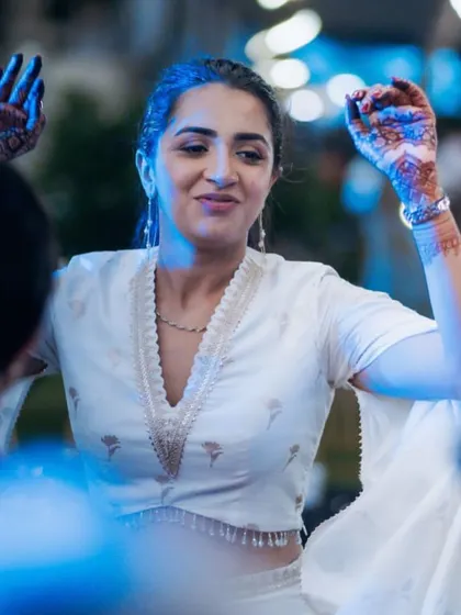 The bride enjoying the music and dancing with her friends at the Sangeet. Our goal is to create a space where everyone, especially the couple, can let loose and have fun.