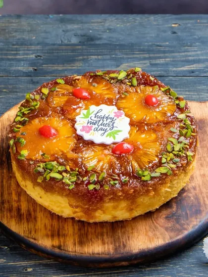 Our classic Pineapple Upside Down Cake, specially decorated for Mother's Day. The moist vanilla cake is topped with sweet, caramelized pineapple rings.