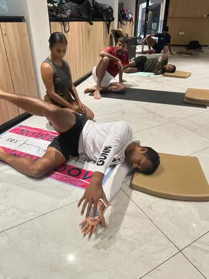 A supine hip and spine twist, a key part of our recovery sequences for athletes. This helps to neutralize the spine and release the deep muscles around the hips.