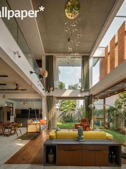The stunning double-height living room of the 'House of Greens', as featured in Wallpaper* magazine.