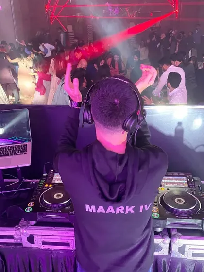 A view from my command center. With professional DJ equipment and a laptop full of mashups, I have everything I need to keep the dance floor packed and the energy high.