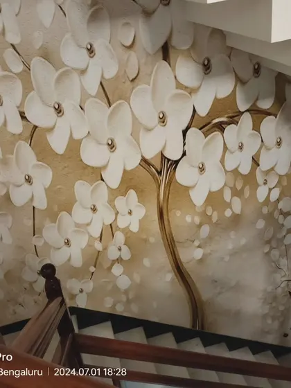A full view of the 3D floral and deer staircase mural.