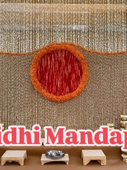 This Vidhi Mandap features a traditional design with a backdrop made entirely of jasmine strings (gajra). The central motif is created with orange marigolds, offering a classic and fragrant setting for the ceremony.